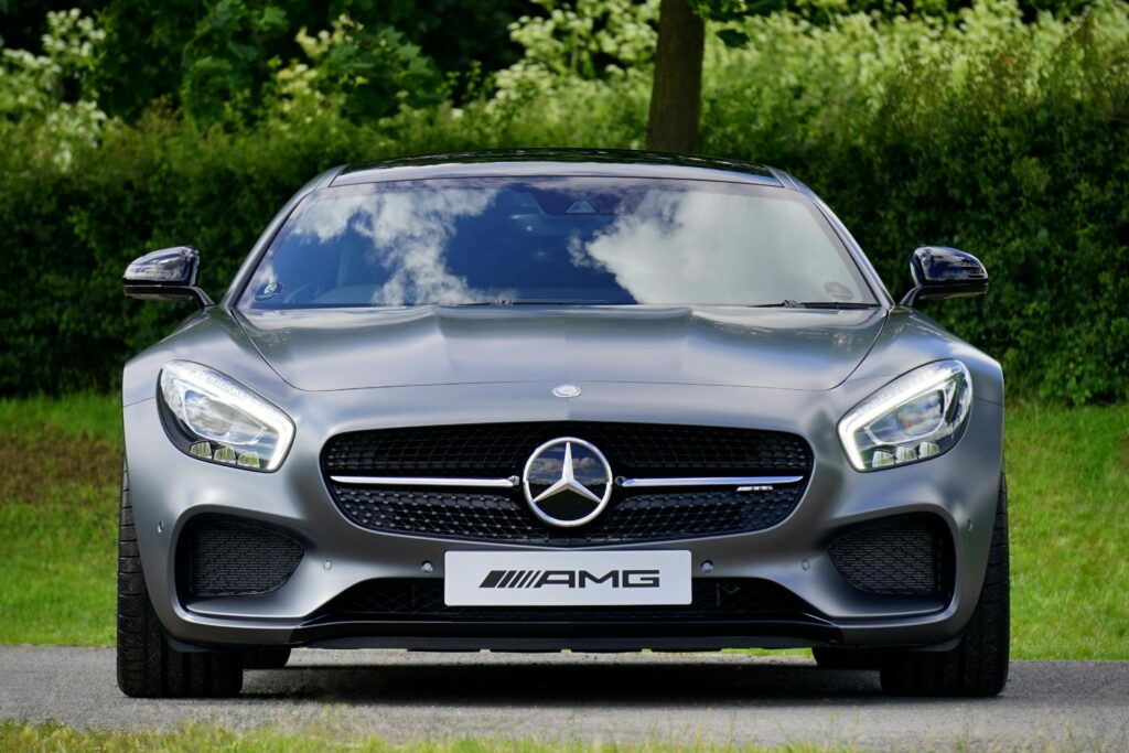 pexels photo 112460 112460 Front view of a luxury Mercedes-Benz AMG against a natural backdrop.